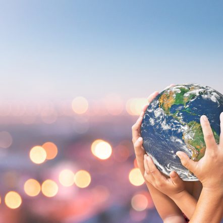 Hands holding the planet