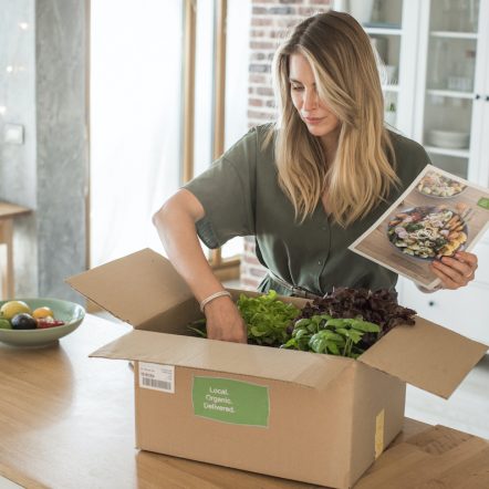 Woman got package from meal delivery service.