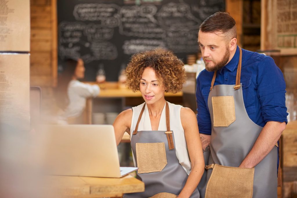 Owners reviewing their business website